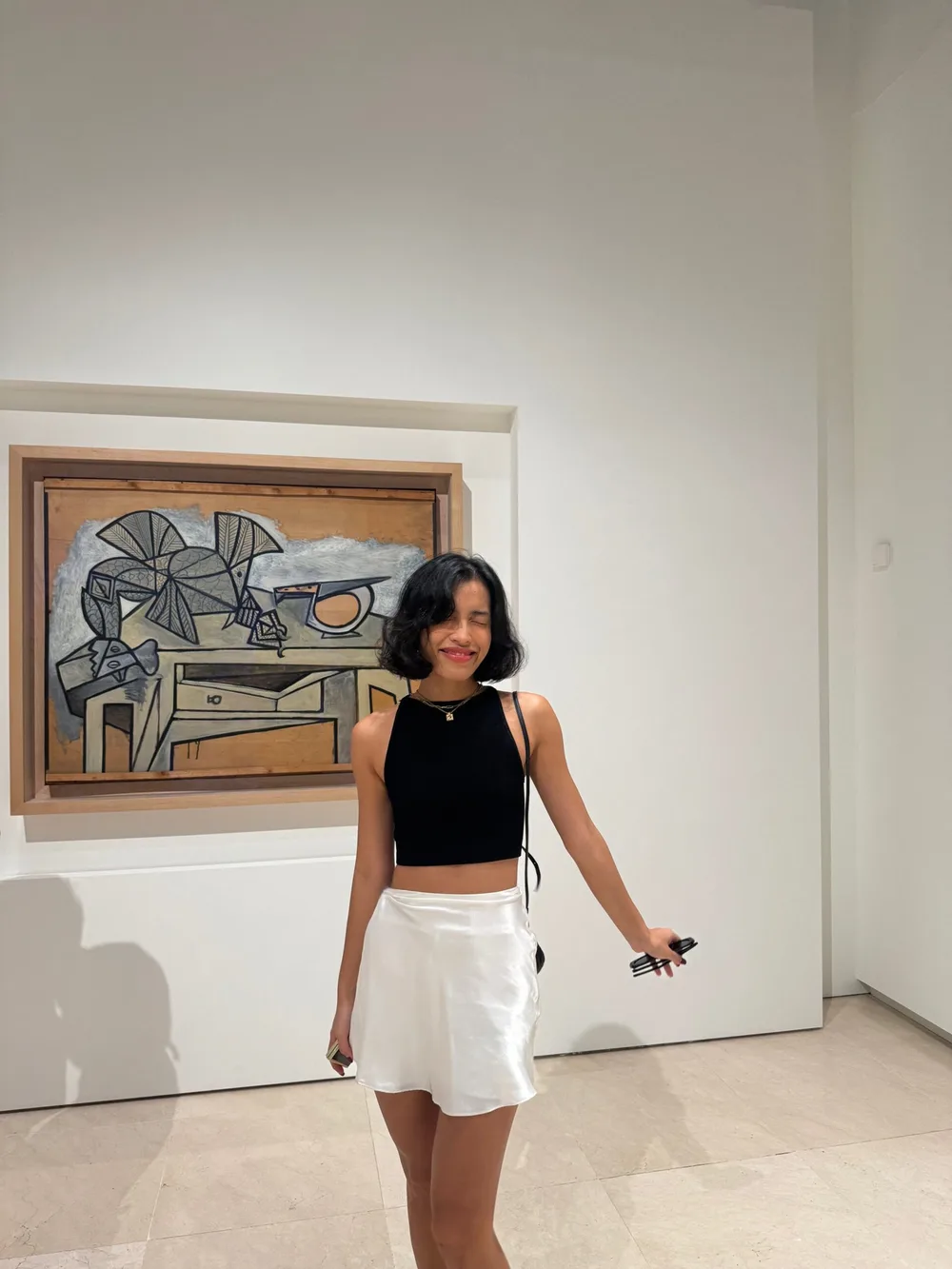 Lilthu smiling in an art gallery